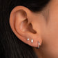 model wearing silver earrings featuring opal silver stud earrings