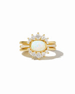 Set of three Sami Jewels opal rings with colorful stones, displayed on a white background.
