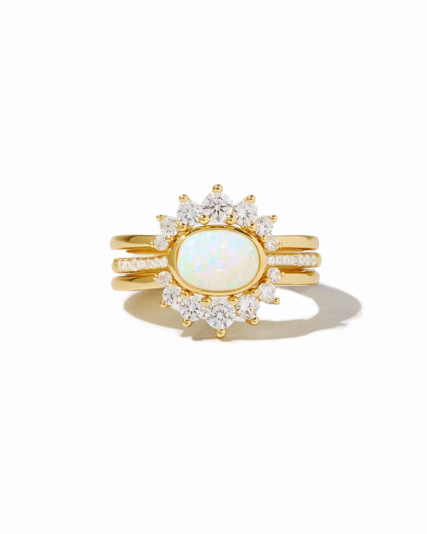 Set of three Sami Jewels opal rings with colorful stones, displayed on a white background.