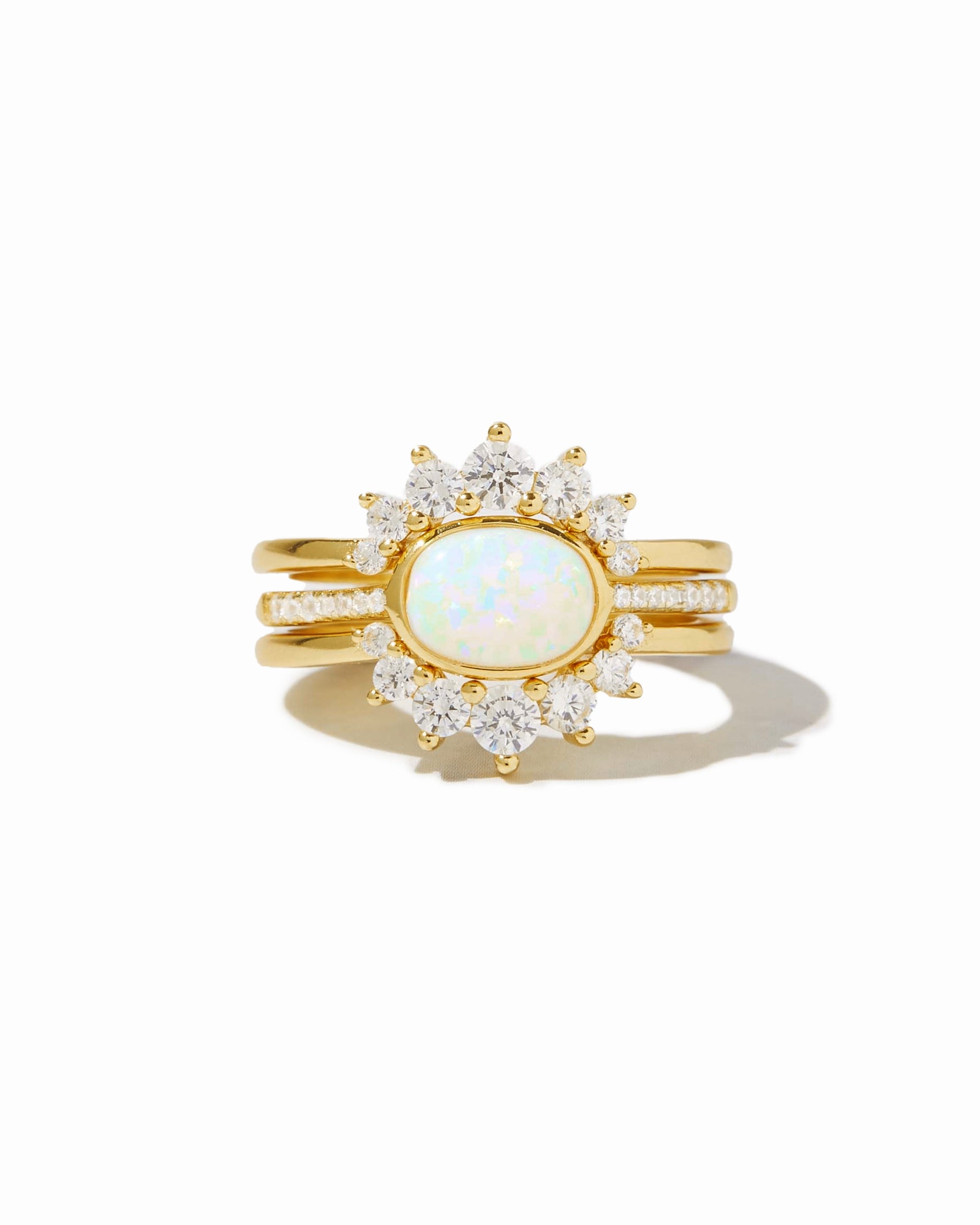Set of three Sami Jewels opal rings with colorful stones, displayed on a white background.