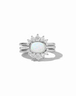 Set of three Sami Jewels opal rings with sterling silver bands, featuring vibrant opal stones on a white background.