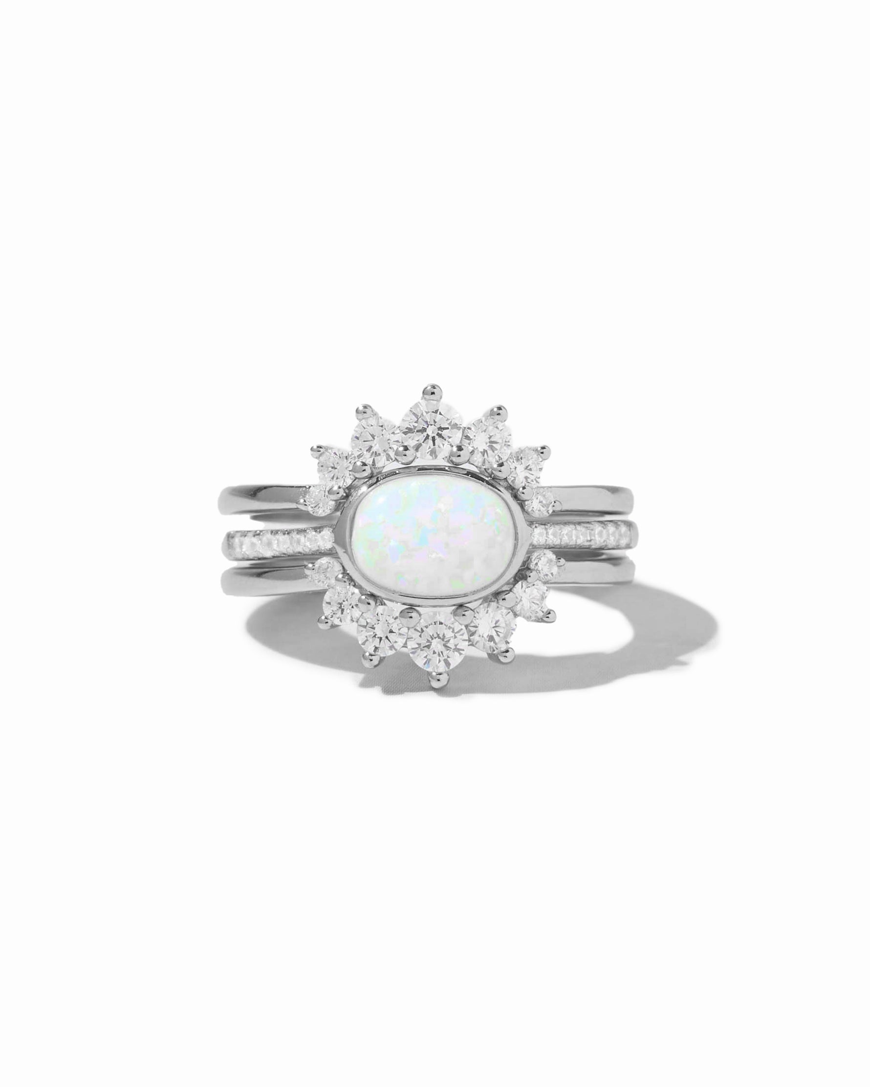 Set of three Sami Jewels opal rings with sterling silver bands, featuring vibrant opal stones on a white background.