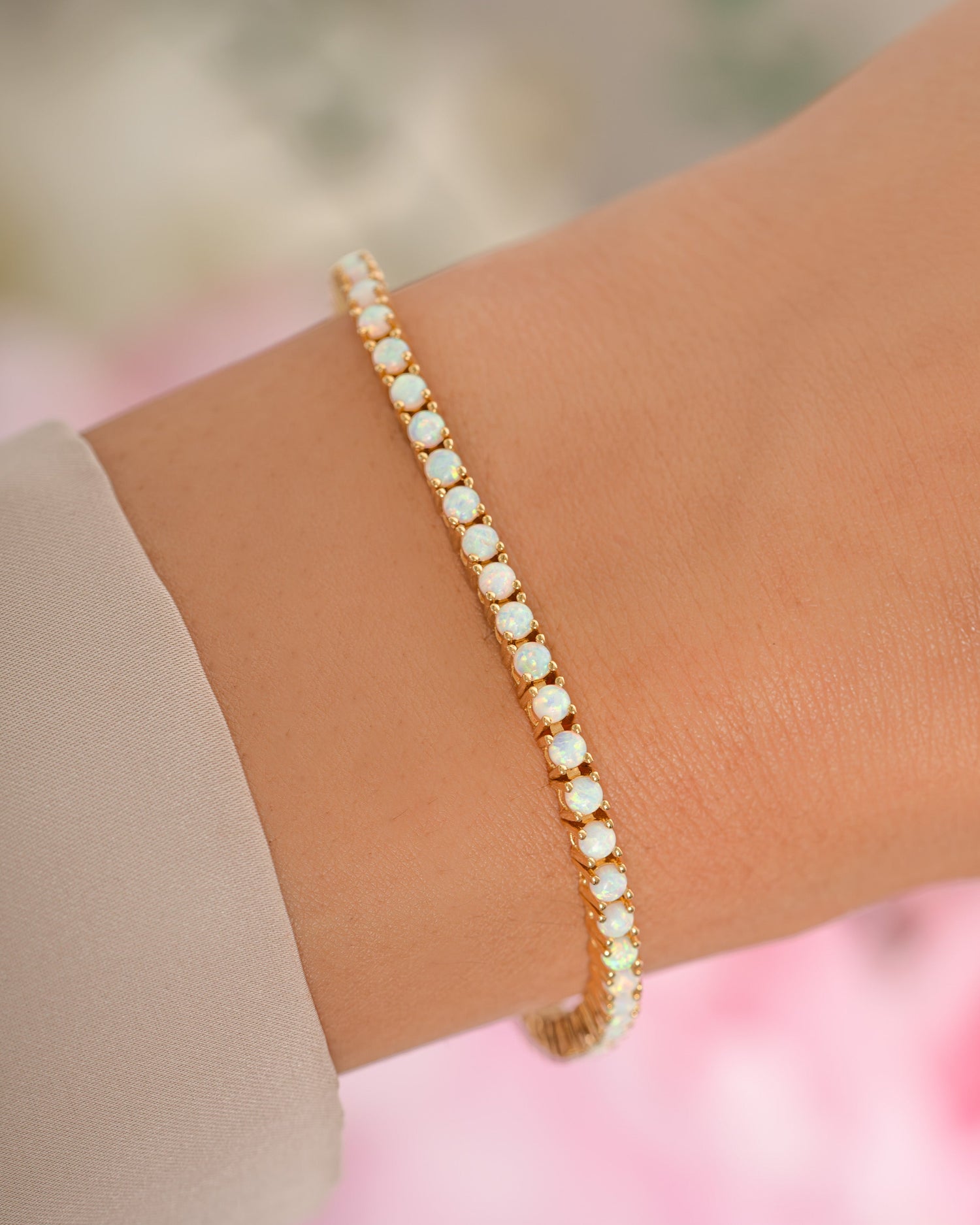 Gold Sami Jewels Opal Tennis Bracelet featuring sparkling opal stones on a delicate bracelet chain.