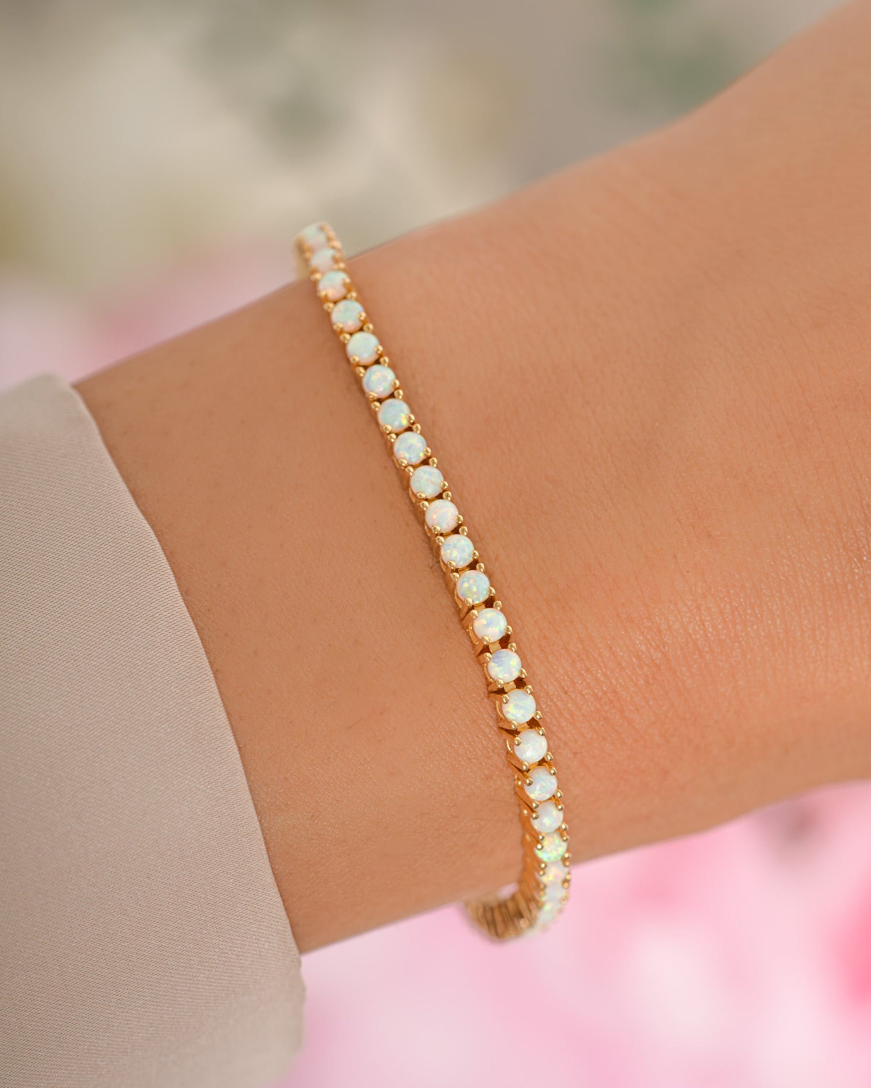 Gold Sami Jewels Opal Tennis Bracelet with sparkling opal stones and delicate chain design.