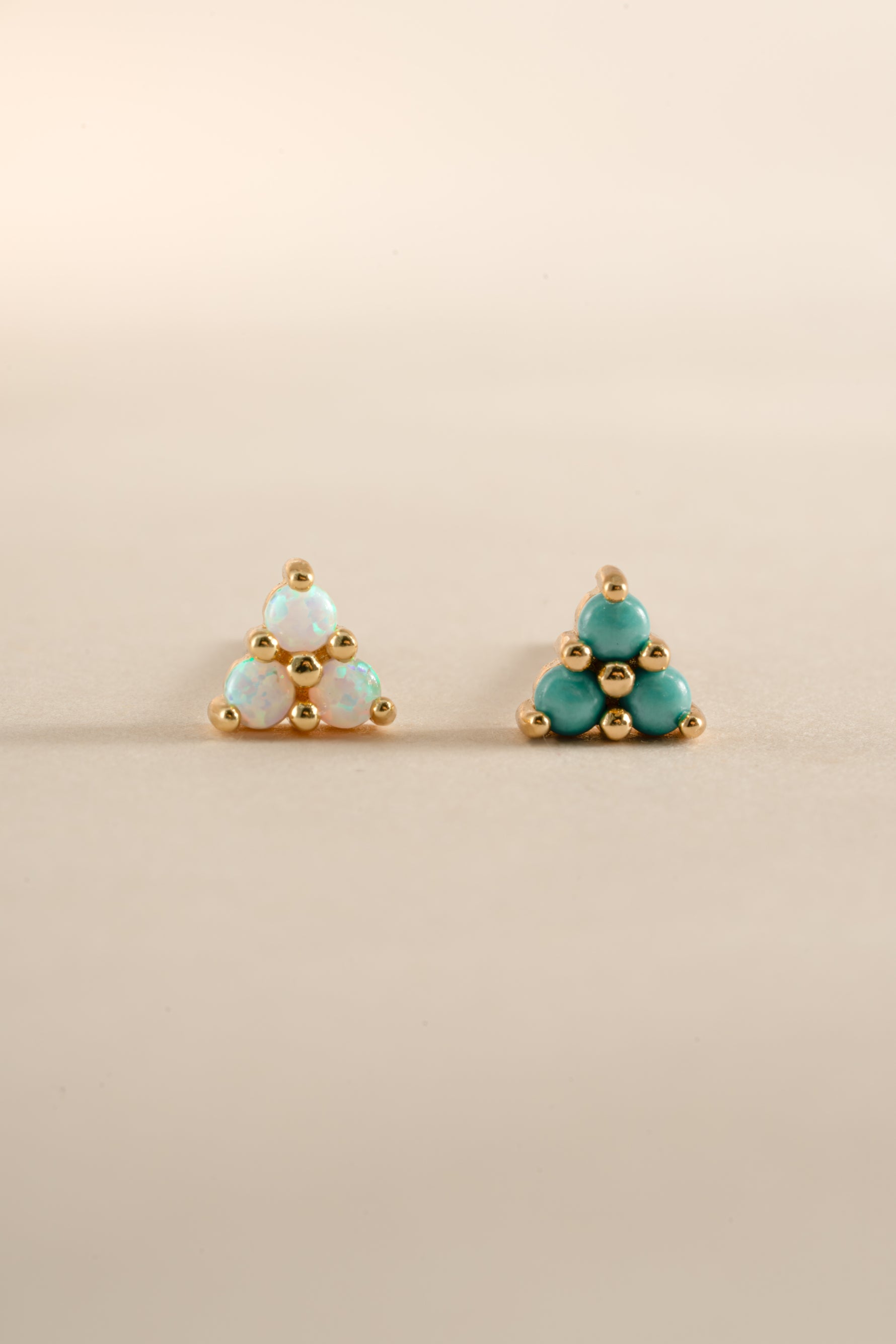 Sami Jewels opal three-stone earrings with turquoise accents in gold setting, showcasing elegant stud earrings design.