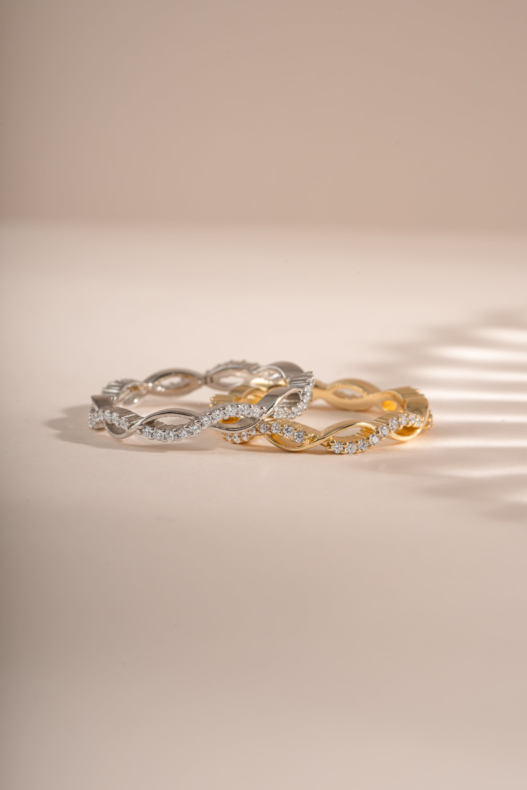 Open infinity ring by Sami Jewels featuring a gold and sterling silver design, showcasing a sleek, open-loop style.