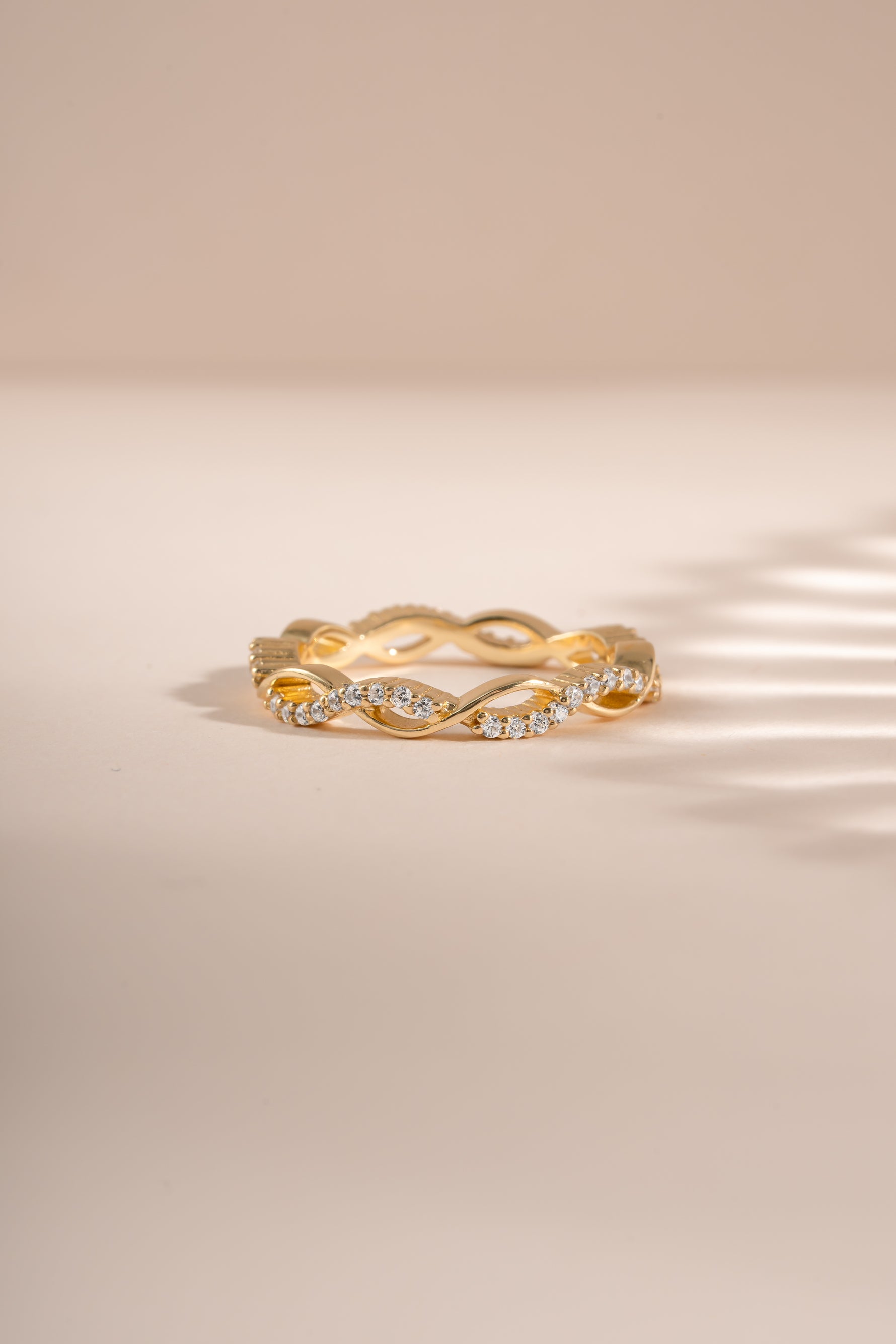 Gold open infinity ring by Sami Jewels featuring a sleek, minimalist design and smooth finish, viewed from the front.