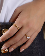 Gold open infinity ring by Sami Jewels featuring a sleek, modern design with an open loop style and smooth finish.