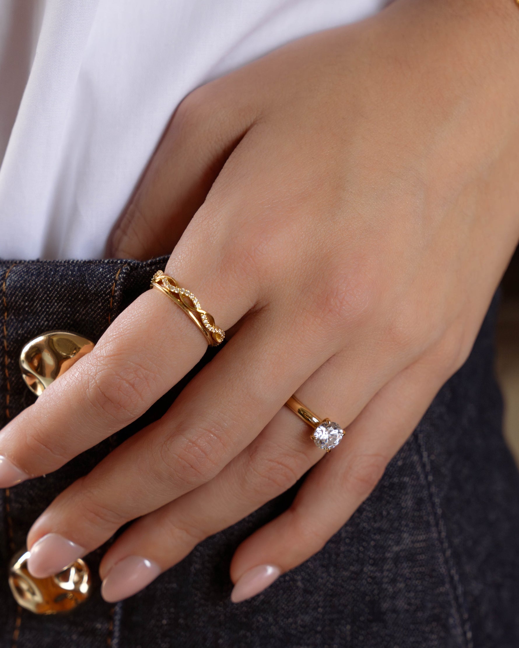 Gold open infinity ring by Sami Jewels featuring a sleek, modern design with an open loop style and smooth finish.