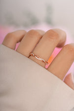 Rose gold open infinity ring by Sami Jewels featuring a sleek, minimalist design and smooth curves.