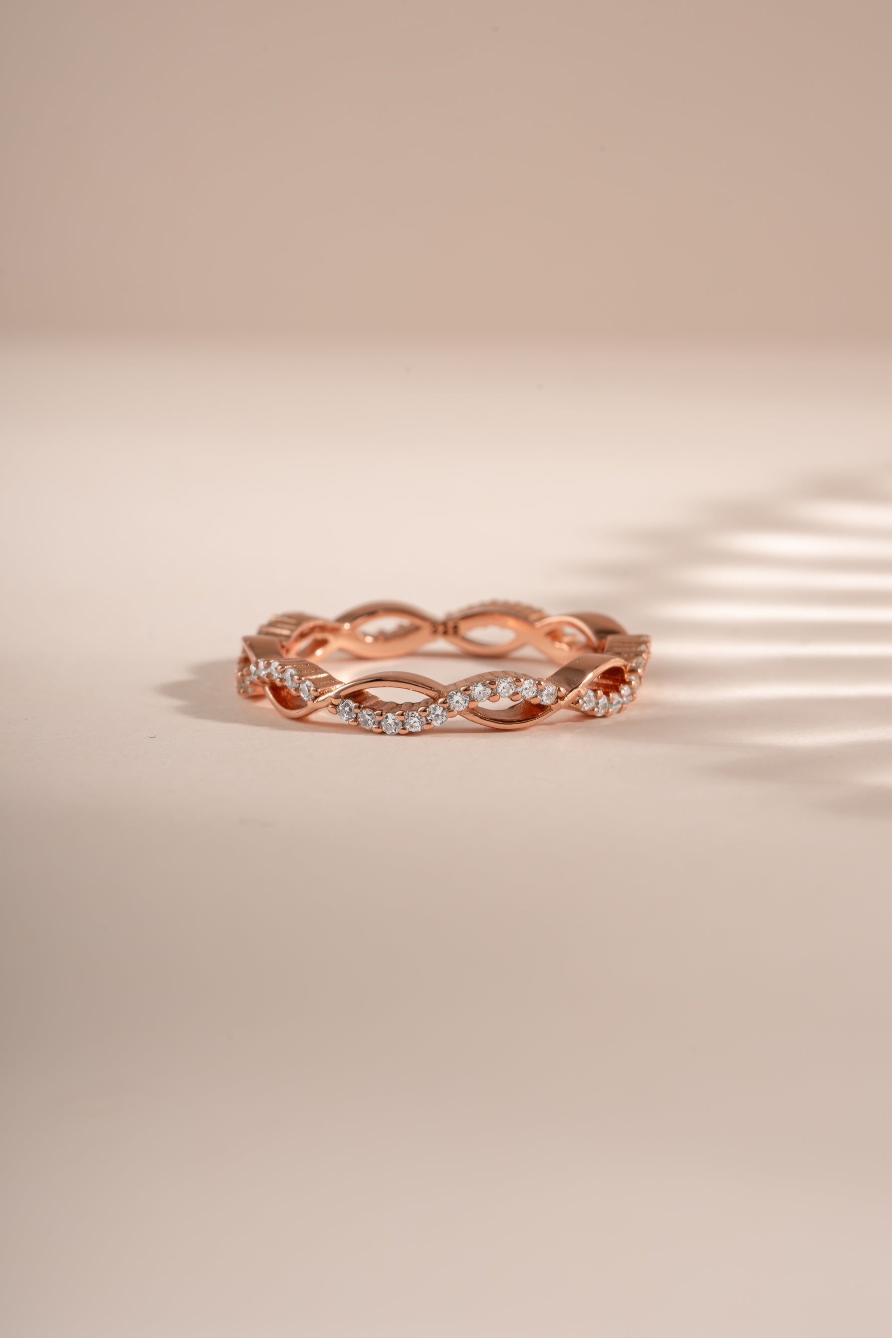 Rose gold open infinity ring by Sami Jewels featuring a sleek, minimalist design with a continuous infinity symbol.