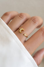 Gold Opal Moon Ring by Sami Jewels featuring an open design with a glowing opal gemstone in a sleek, elegant style.