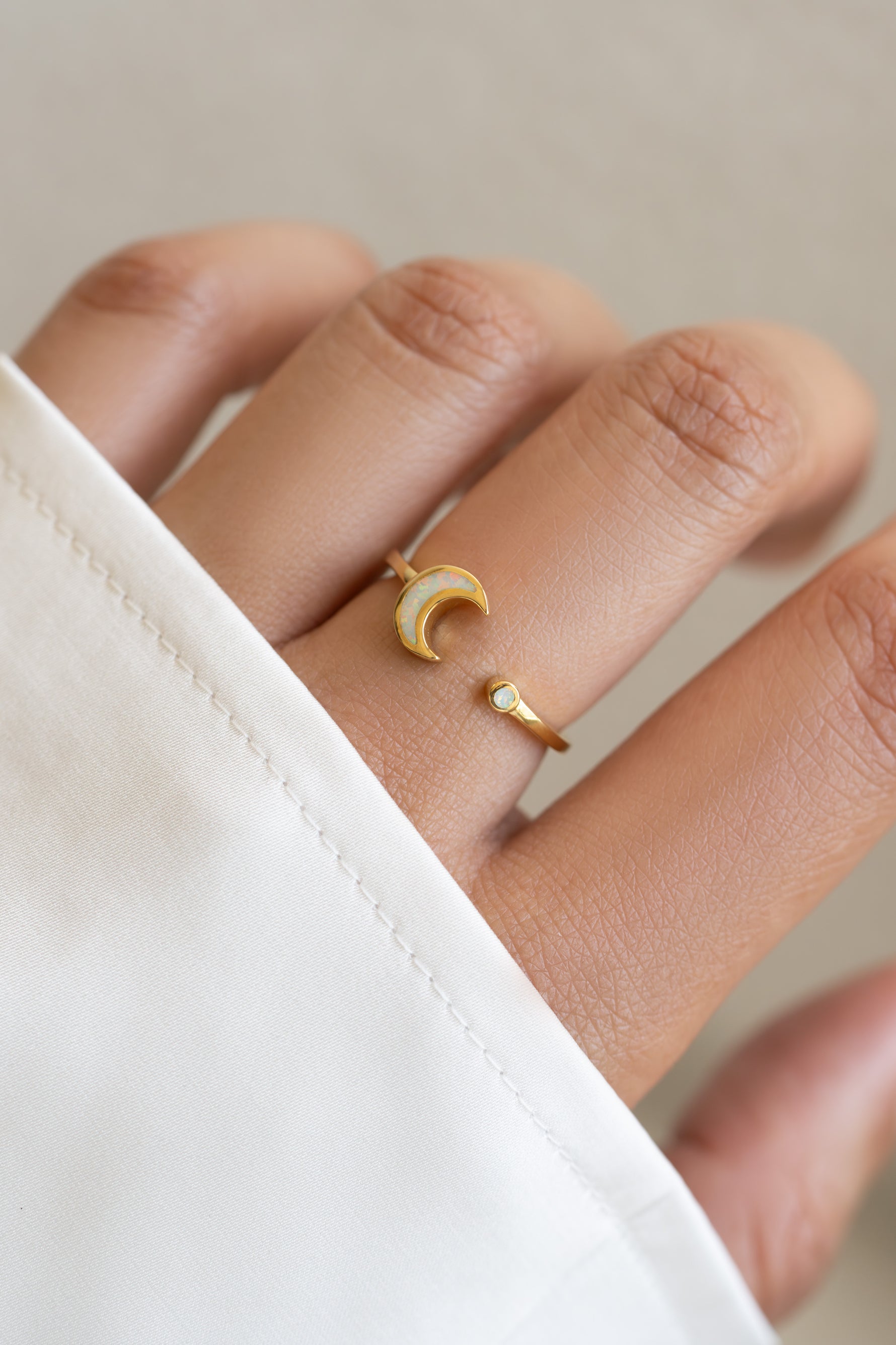Gold Opal Moon Ring by Sami Jewels featuring an open design with a glowing opal gemstone in a sleek, elegant style.