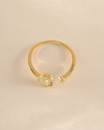 Gold Opal Moon Ring by Sami Jewels featuring an open design and a luminous opal gemstone, viewed from the top.