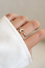 Sterling silver Opal Moon Ring by Sami Jewels featuring an open band and a luminous opal gemstone.
