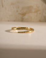 Gold open spiral ring from Sami Jewels with a sleek, modern design, shown from the front view.