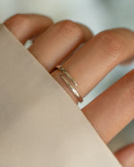 Sterling silver open spiral ring by Sami Jewels, featuring a sleek, minimalist design on a white background.