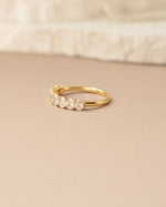 Side view of Sami Jewels oval diamond ring featuring a gold band and elegant design.