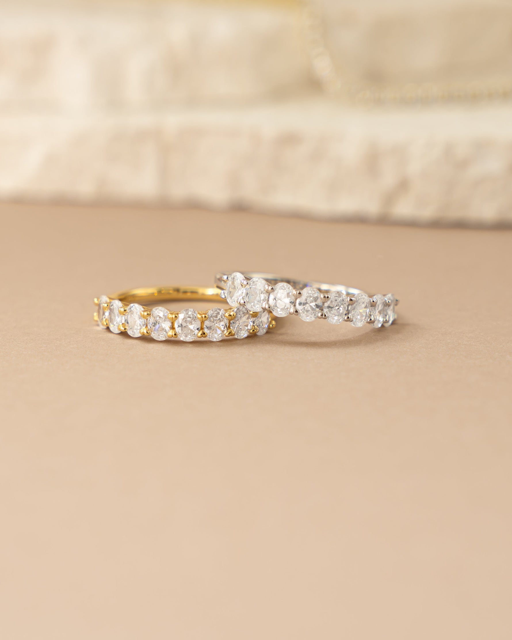 Oval diamond ring by Sami Jewels featuring a gold and sterling silver band with detailed stone accents.