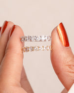 Oval diamond ring by Sami Jewels featuring a gold and sterling silver band on a white background.