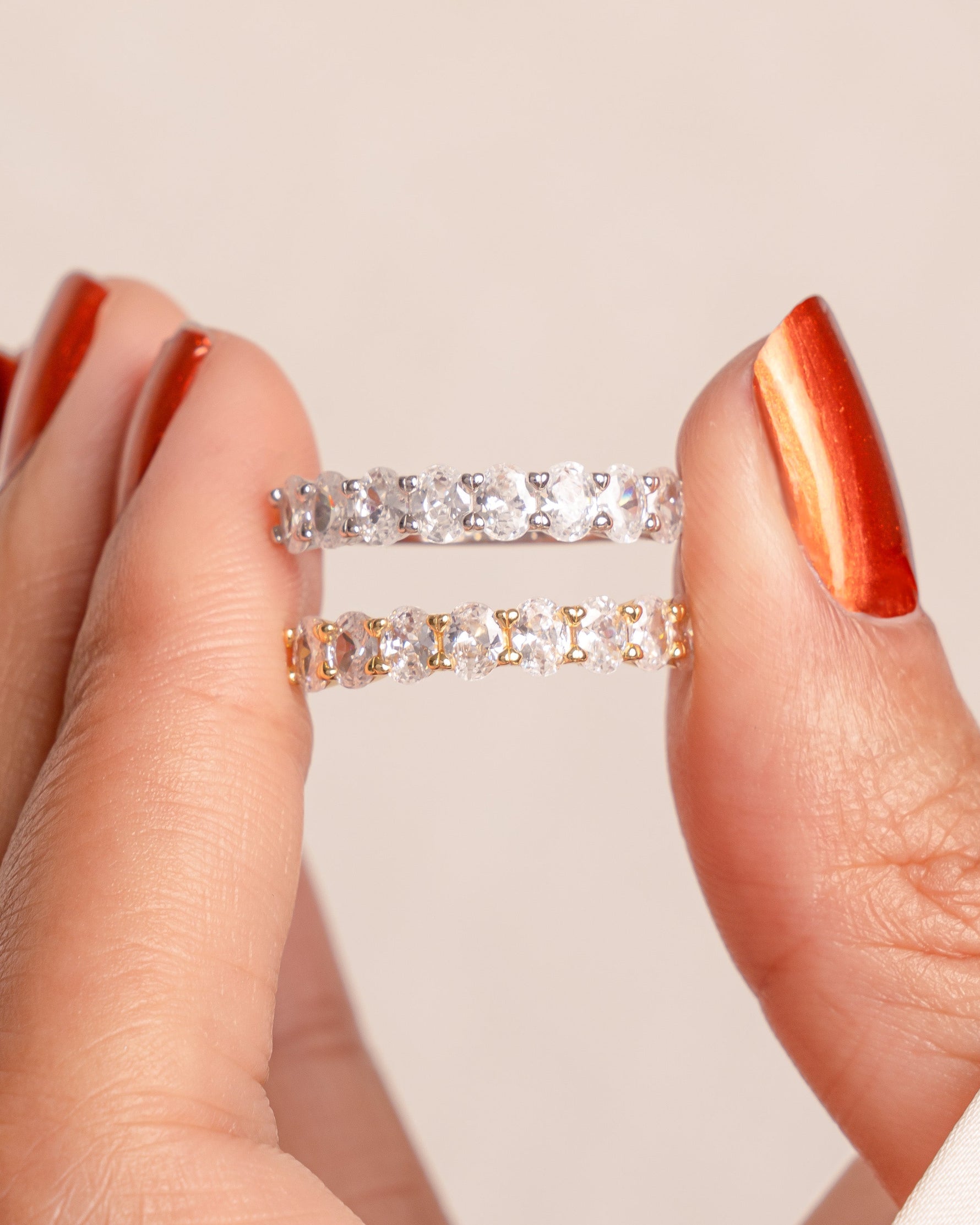 Oval diamond ring by Sami Jewels featuring a gold and sterling silver band on a white background.