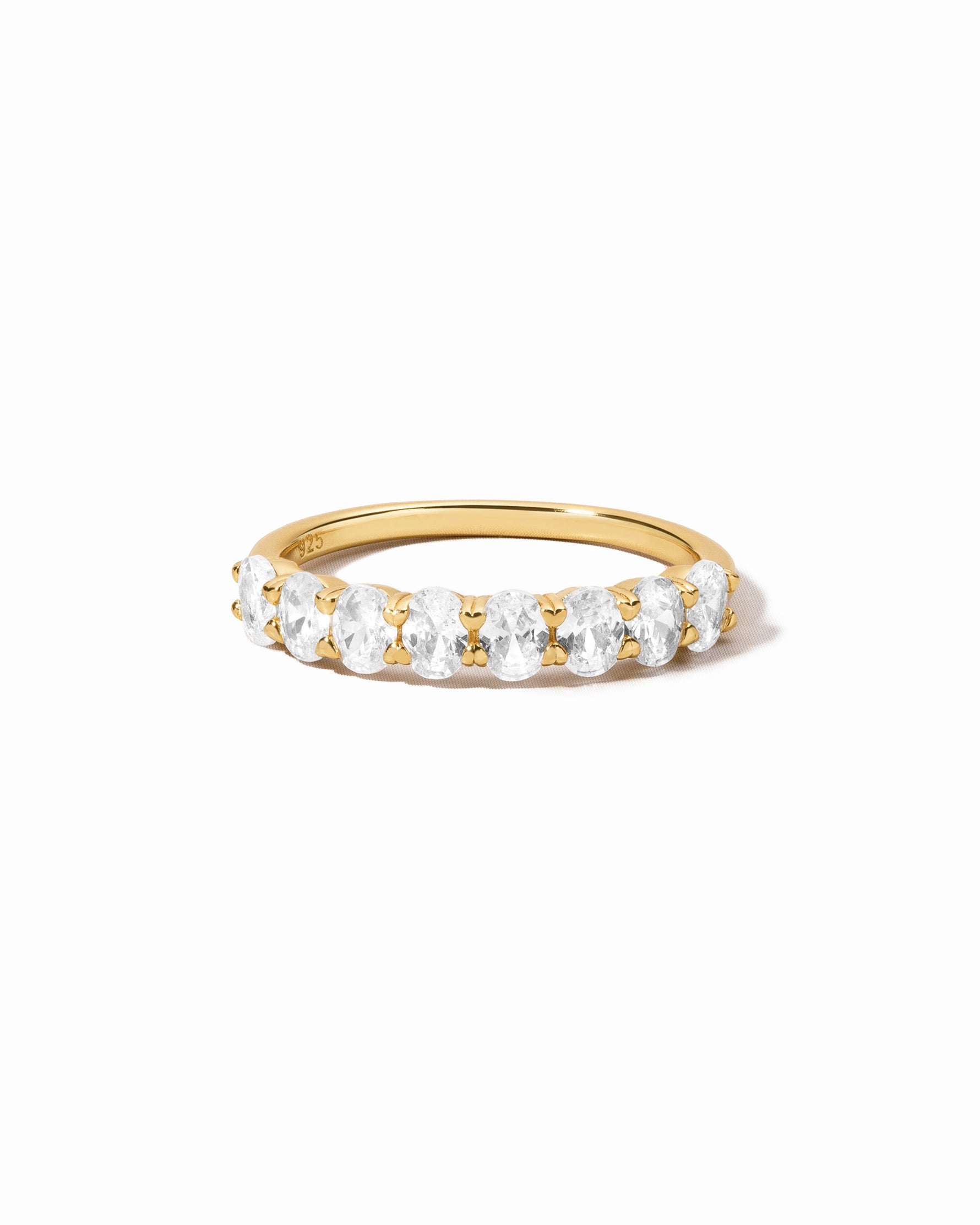 Elegant oval diamond ring by Sami Jewels featuring a gold band, showcased against a white background.