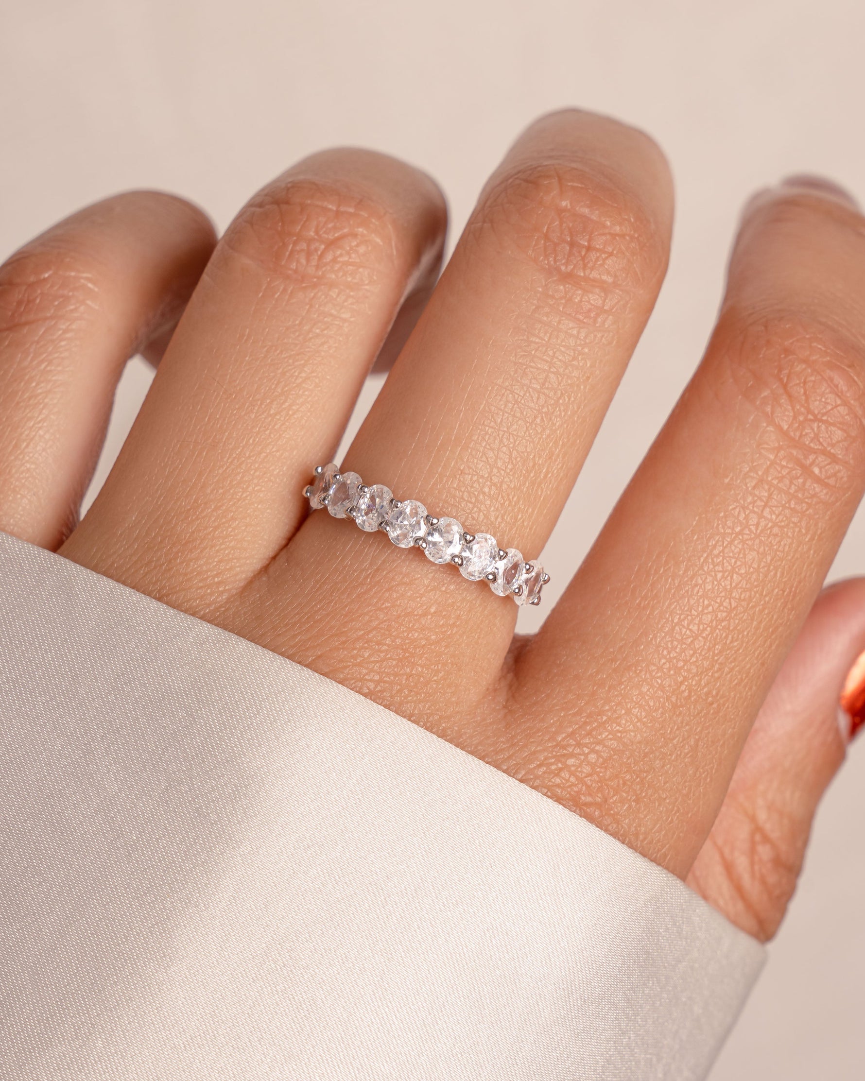Sami Jewels oval diamond ring with sterling silver band and gold accents, showcasing a sparkling oval-shaped diamond.