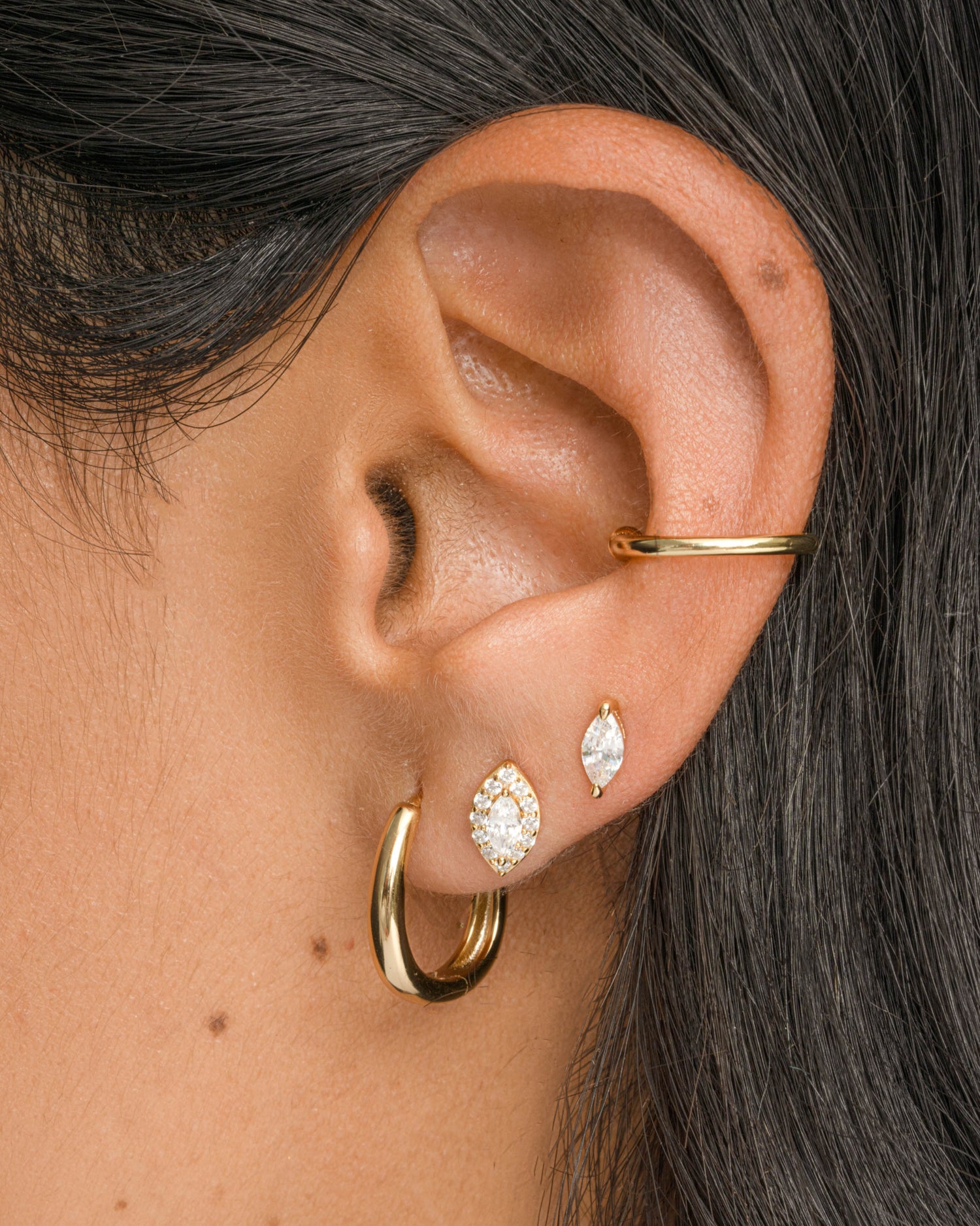 Gold oval hoop earrings by Sami Jewels featuring smooth, polished loops suitable for elegant or casual wear.