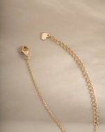 Gold oval medallion necklace with lobster clasp closure by Sami Jewels, showcasing a sleek, elegant jewelry design.