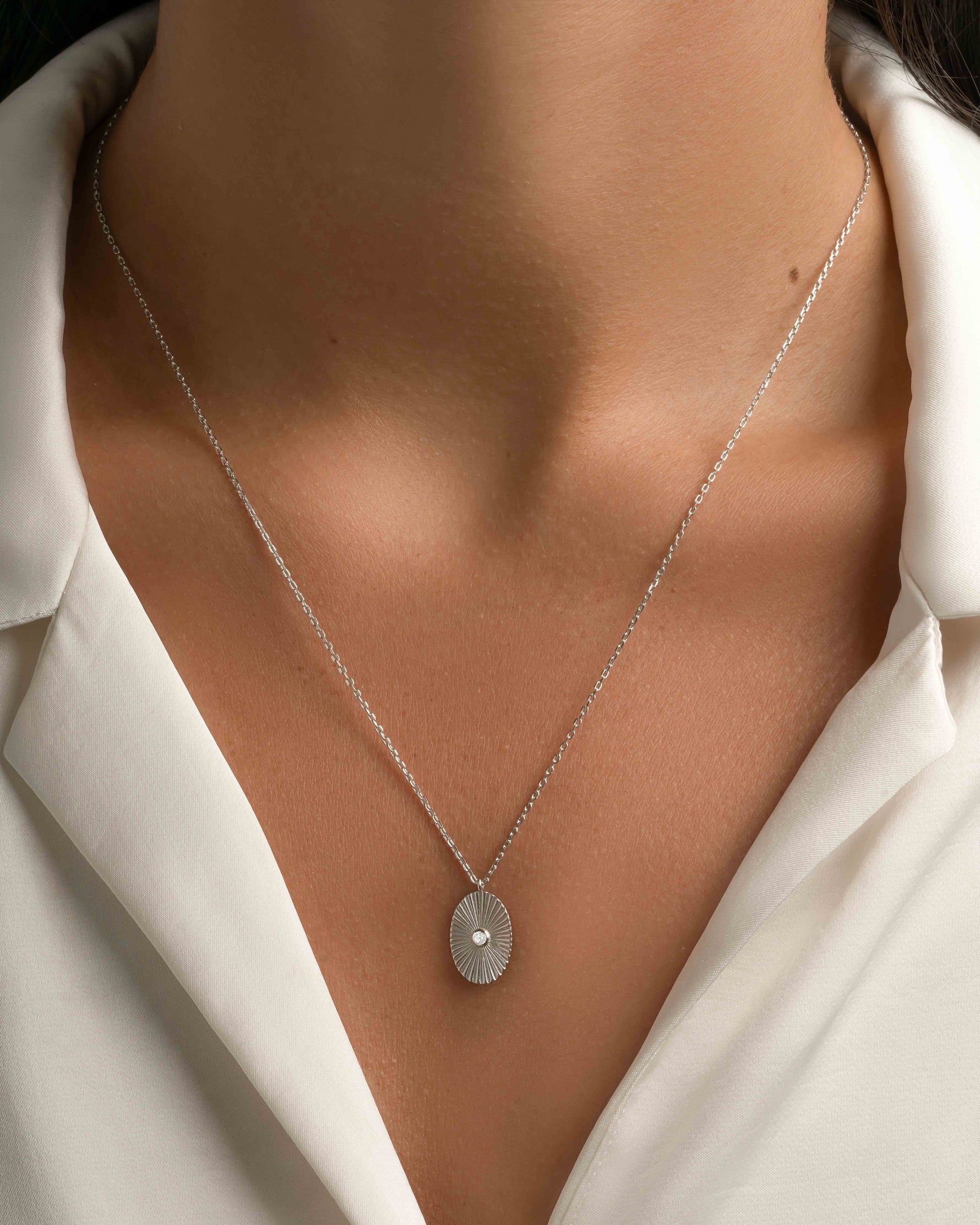 Sterling silver Oval Medallion Necklace by Sami Jewels, featuring a polished oval pendant on a delicate chain.