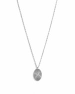 Sterling silver oval medallion necklace by Sami Jewels displayed on a white background.