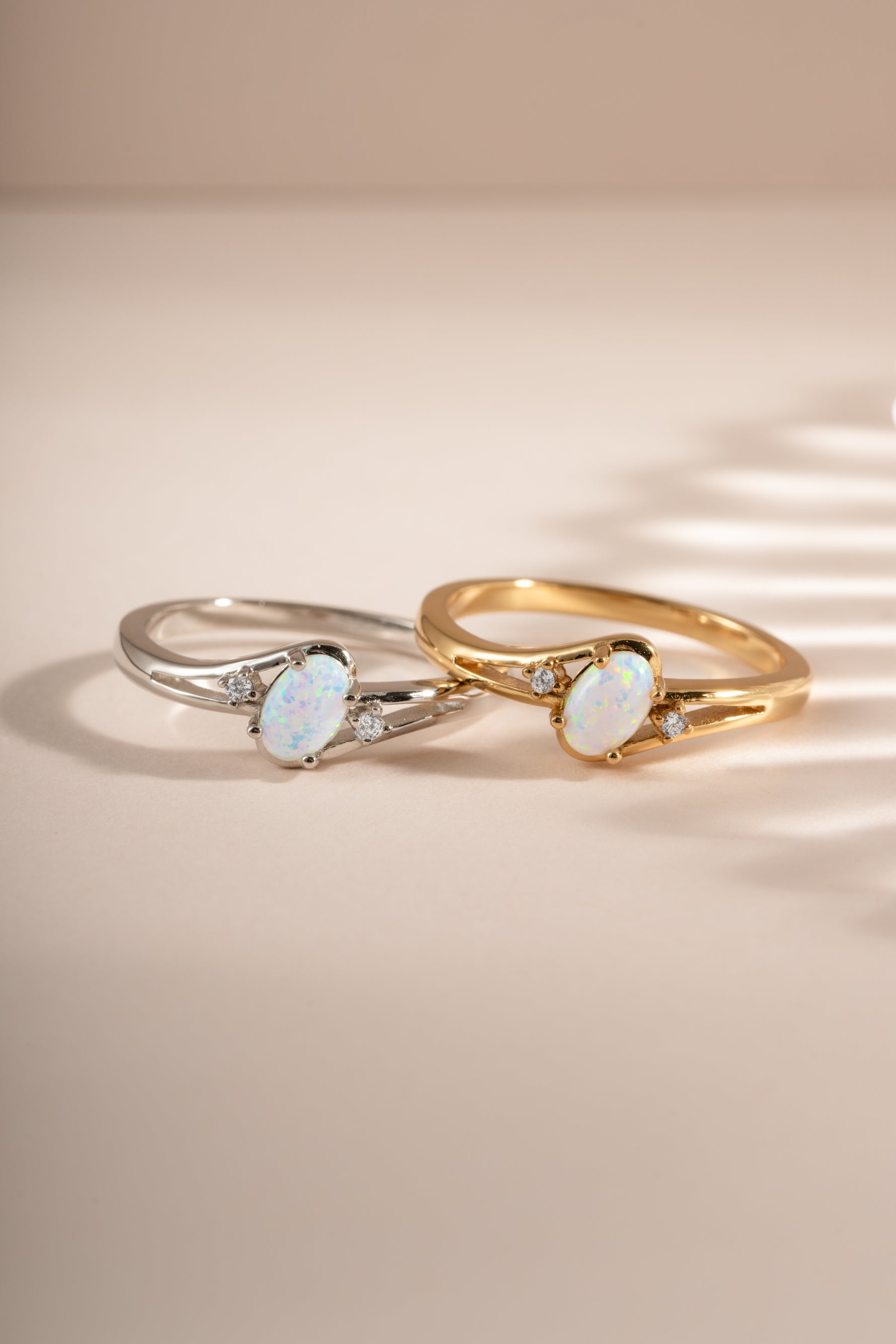 Small oval opal ring by Sami Jewels featuring a gold and sterling silver band with a vibrant oval opal gemstone.