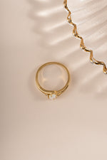 Gold small oval opal ring from Sami Jewels, top view showing the smooth oval opal gemstone set in a gold band.