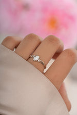 Sterling silver small oval opal ring from Sami Jewels featuring a polished oval opal gemstone.