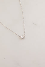Sterling silver oval pendant necklace from Sami Jewels featuring a close-up view of the elegant jewelry piece.
