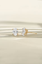 Gold 4x6mm oval studs shown from the front and side with sunlight across the display.