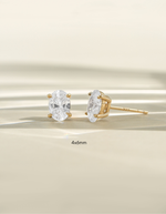 Gold 4x6mm oval stud earrings from Sami Jewels, front view showing smooth, polished surface and classic oval shape.