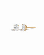 Gold 4x6mm oval CZ stud earrings shown from the front and side on white.