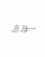 Sterling silver 4x6mm oval stud earrings by Sami Jewels displayed on a white background.