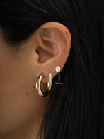Gold 5x7mm oval stud earrings from Sami Jewels, simple and elegant jewelry for everyday wear.