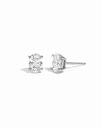 Sterling silver 5x7mm oval stud earrings by Sami Jewels on a white background.
