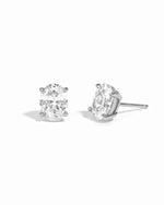 Sterling silver 6x8mm oval stud earrings from Sami Jewels, shown on a white background.