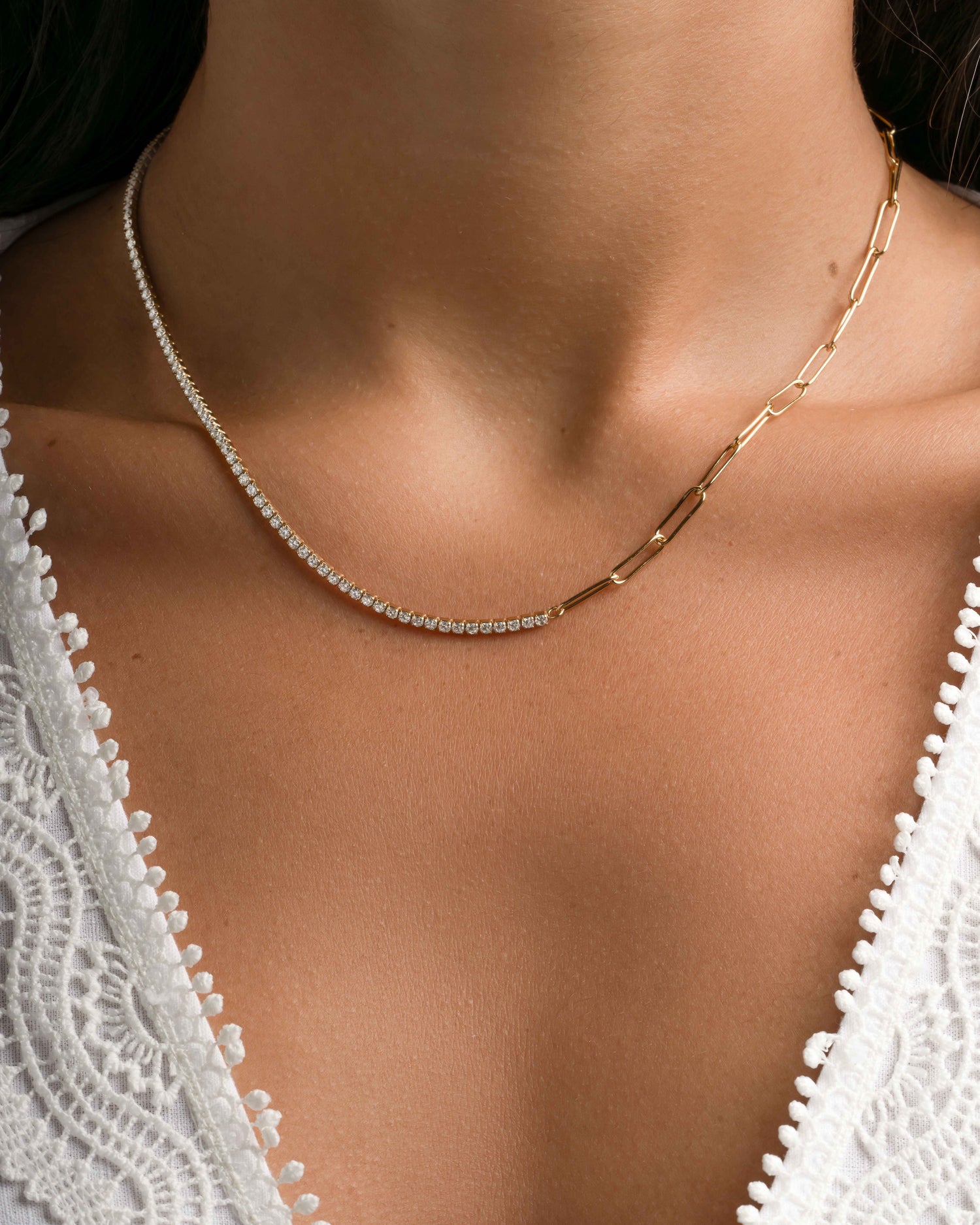 Gold tennis and paperclip necklace by Samijewels-527 featuring sleek, interconnected chain links on a model.