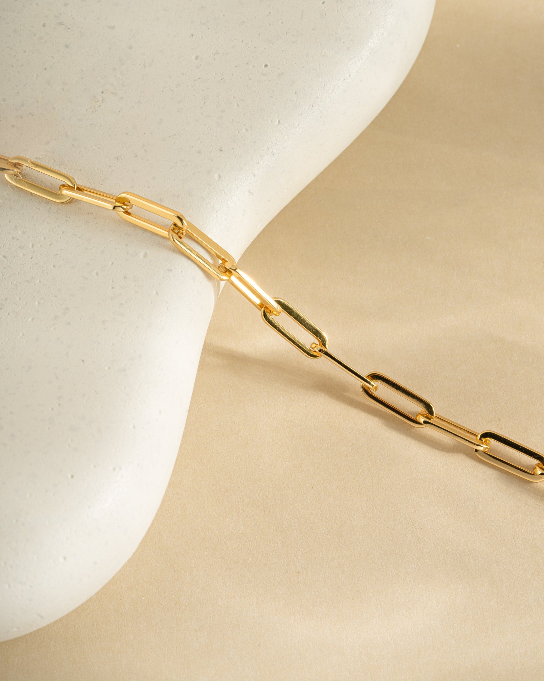 Close-up of Sami Jewels Amanda Paperclip Bracelet in gold, showing sleek, modern paperclip design on a white background.