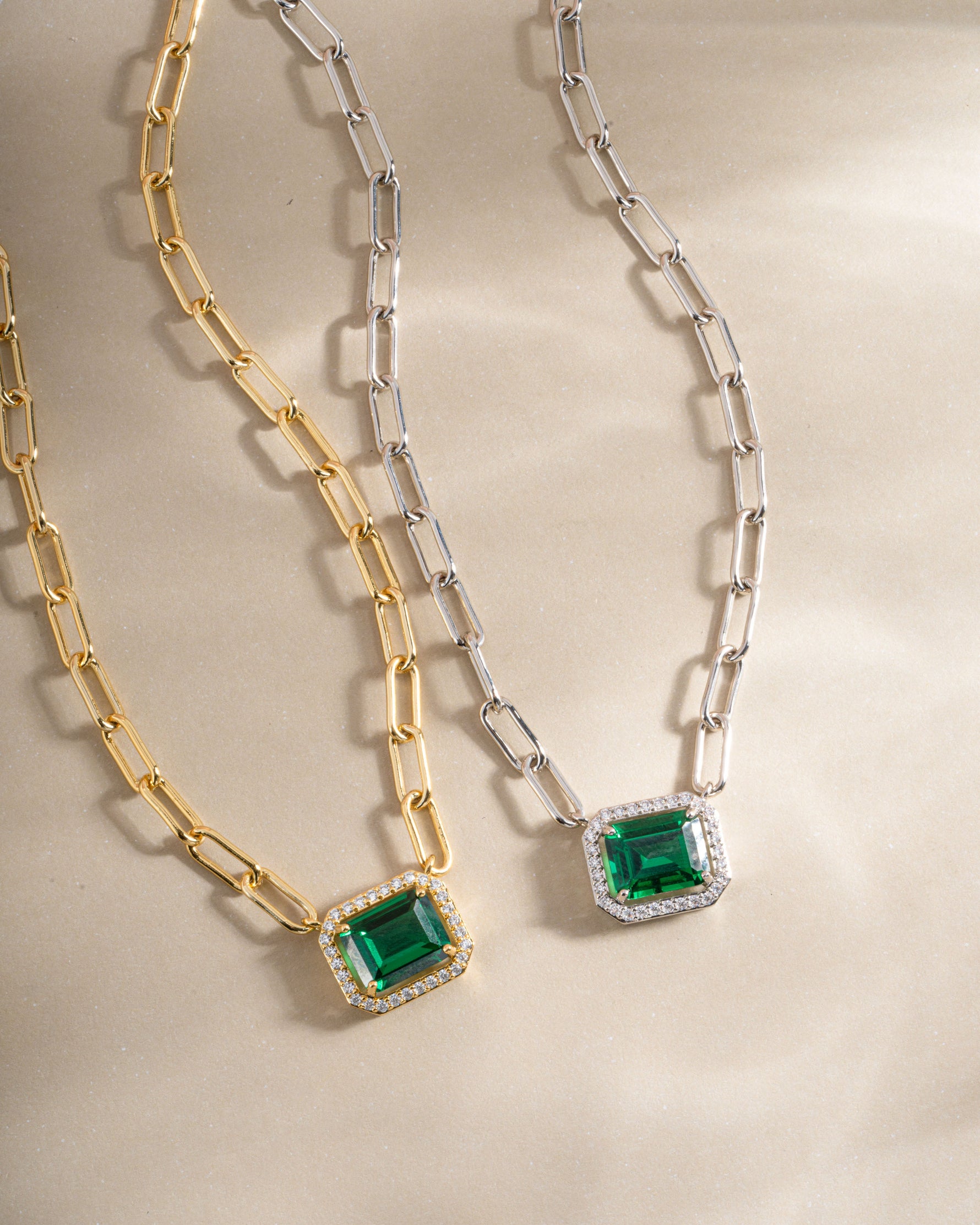 Gold and silver paperclip necklace with emerald pendant from Sami Jewels, featuring a modern and elegant jewelry design.