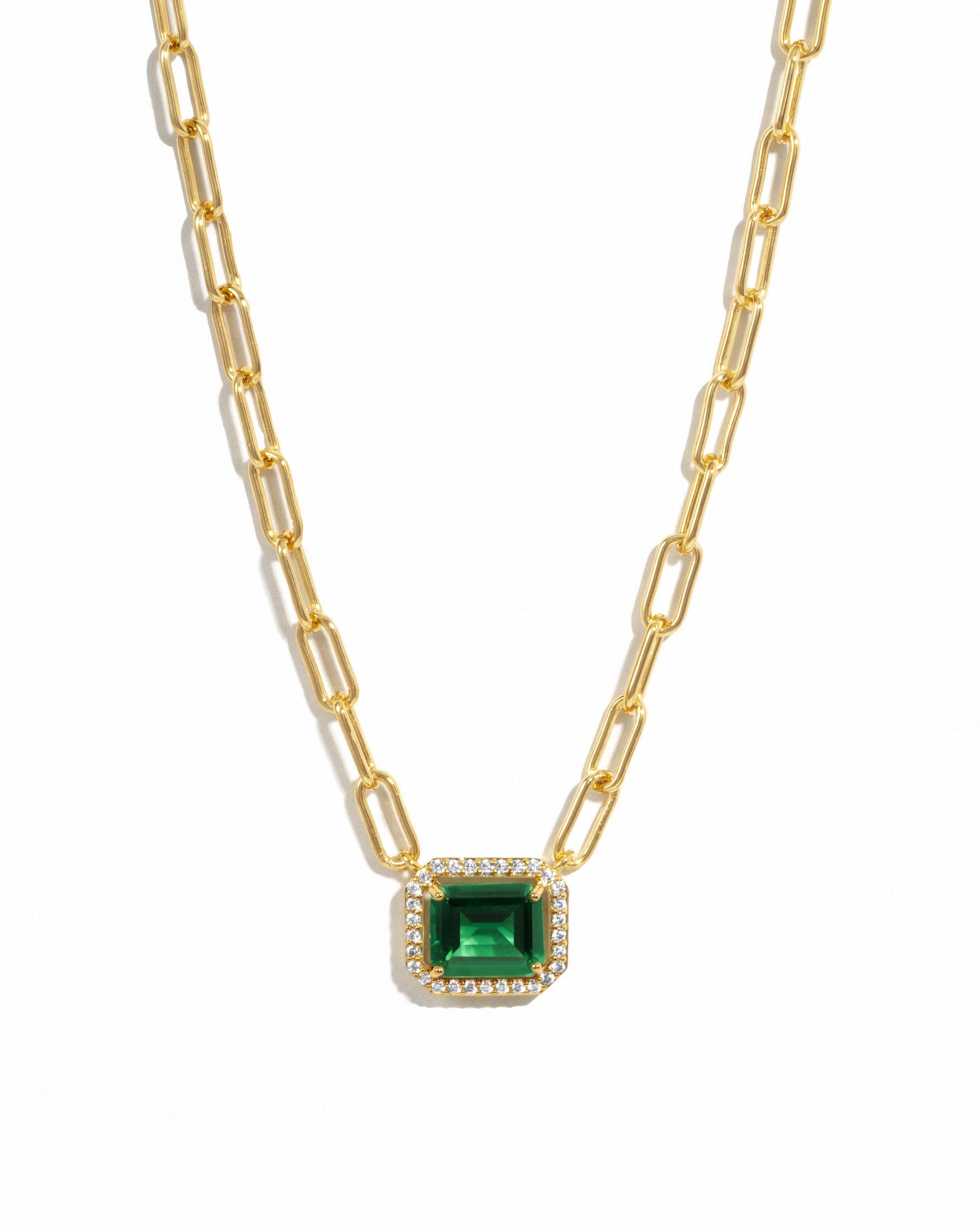 Gold paperclip necklace with emerald pendant from Sami Jewels, featuring a sleek design against a white background.