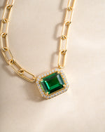 Gold Paperclip Emerald Pendant Necklace by Sami Jewels featuring a sleek chain and a vibrant emerald pendant.