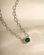 Silver paperclip necklace with emerald pendant from Sami Jewels, front view showing sleek design and vibrant green gemstone.