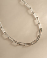 Close-up of a sterling silver Paperclip Necklace by Sami Jewels, showing its sleek, modern design with interconnected paperclip links.