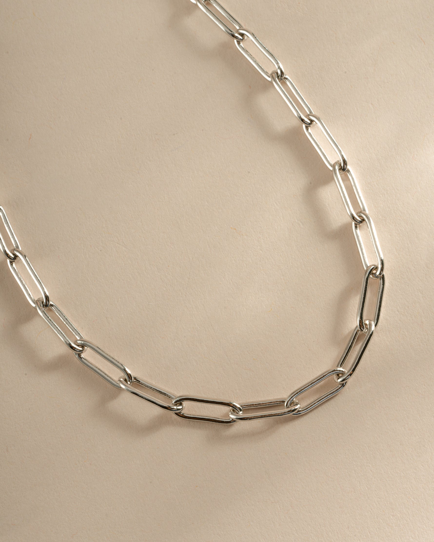 Close-up of a sterling silver Paperclip Necklace by Sami Jewels, showing its sleek, modern design with interconnected paperclip links.